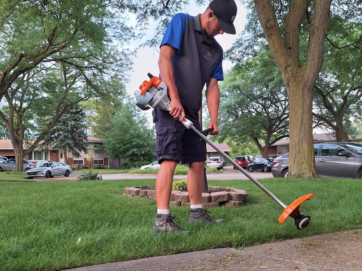 String trimming a lawn — Steadfast Home Services